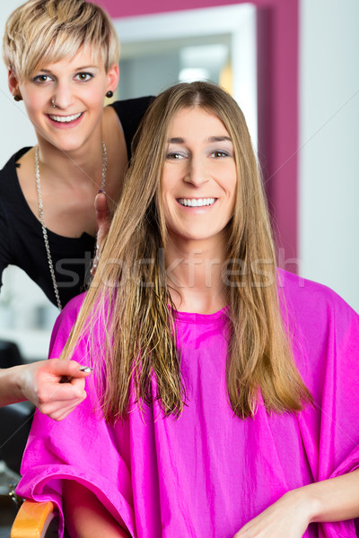 Woman at the hairdresser getting advise Stock photo © Kzenon