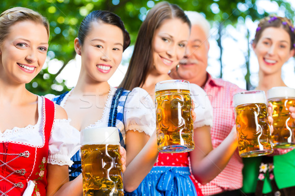 Beer garden - friends drinking in Bavaria Pub Stock photo © Kzenon