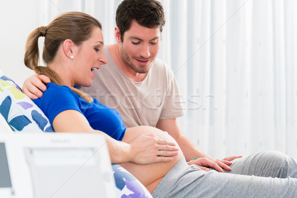 Pregnant woman in delivery room with her man Stock photo © Kzenon