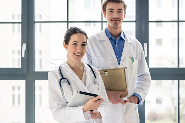 Stock photo: Portrait of two determined physicians looking at camera in a mod