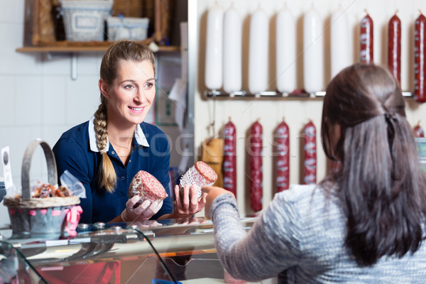 Sales lady in butchery shop serving customer Stock photo © Kzenon