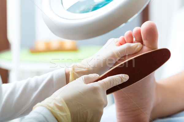 Woman receiving podiatry treatment in Day Spa Stock photo © Kzenon
