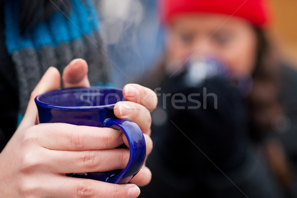 Women on Christmas market drinking punch Stock photo © Kzenon