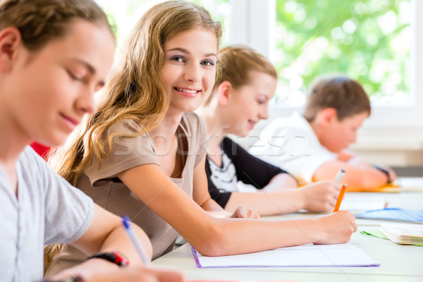 Students writing a test in school concentrating Stock photo © Kzenon