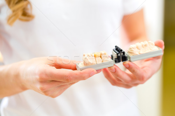 Dental technician checking denture Stock photo © Kzenon