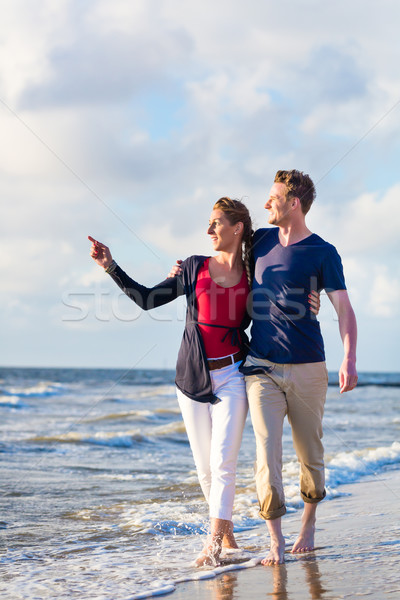 Couple take a walk at German north sea beach Stock photo © Kzenon