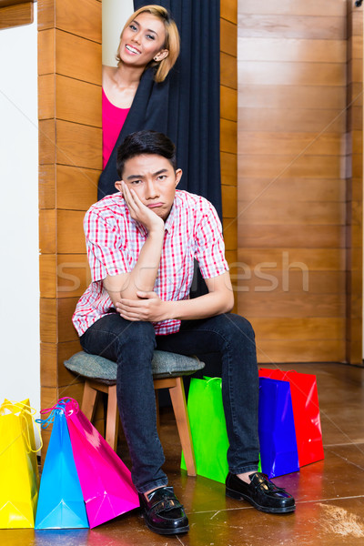 Man waiting for woman in front of dressing room  Stock photo © Kzenon