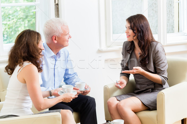 Advisor giving investment advice to senior couple Stock photo © Kzenon