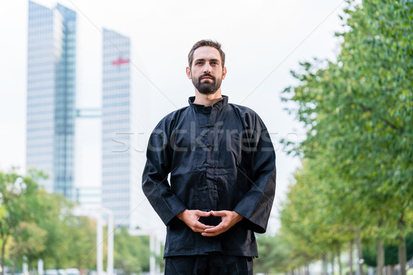 Adam meditasyon dövüş sanatları şehir Bina uygunluk Stok fotoğraf © Kzenon