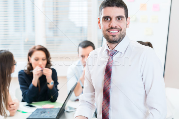 Man and group having business meeting in office Stock photo © Kzenon