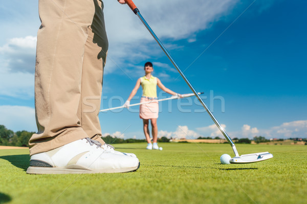 Close-up side view of the feet of a male professional golf player Stock photo © Kzenon