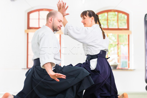 Man and woman fighting at Aikido martial arts school Stock photo © Kzenon