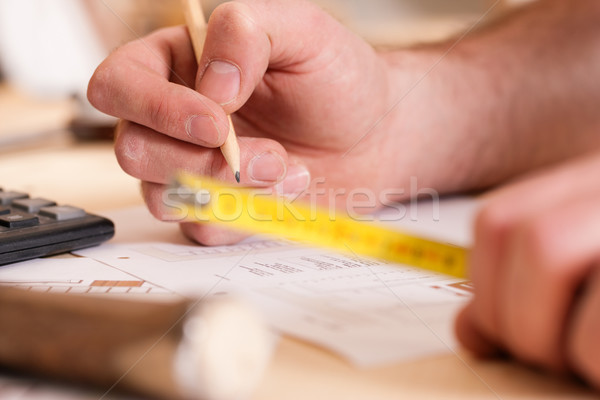 Carpenter planning his work  Stock photo © Kzenon