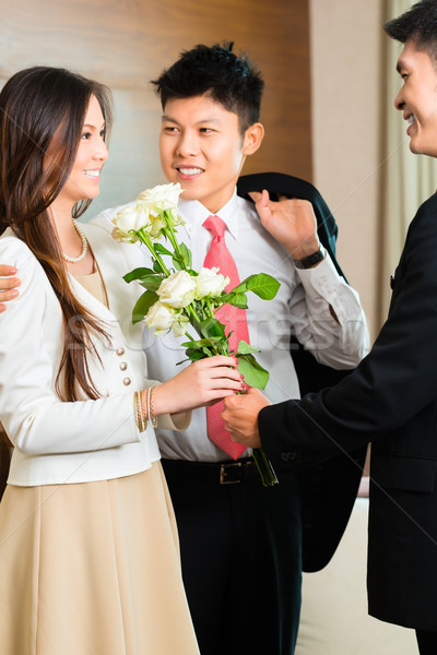 Asian Chinese hotel manager welcome VIP guests Stock photo © Kzenon