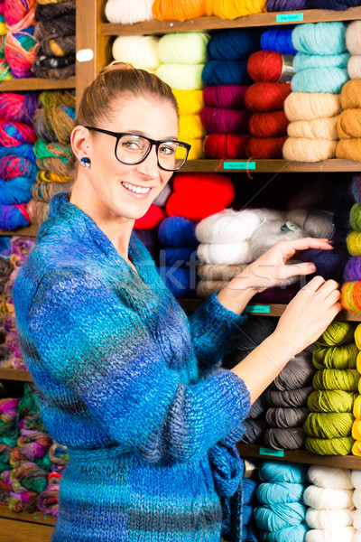 Stock photo: Young women in knitting shop