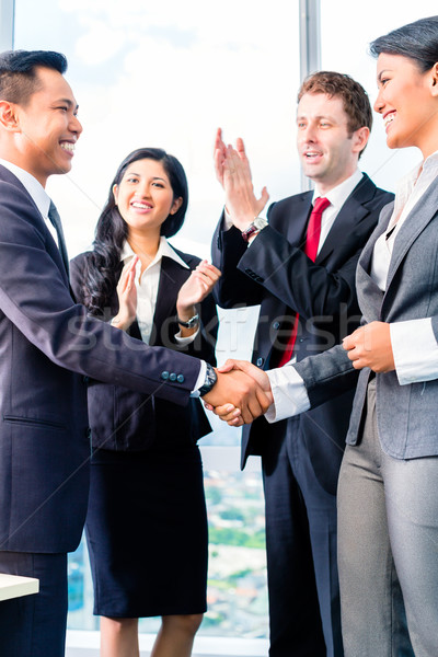 Asian Businesspeople shaking hands Stock photo © Kzenon