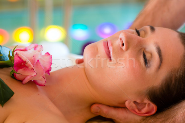 Stock photo: Woman enjoying head massage in a spa
