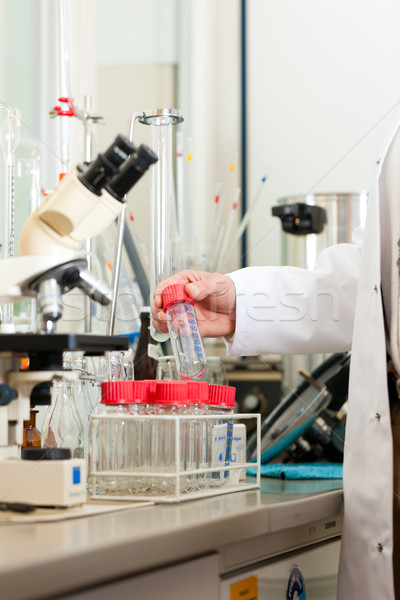 Beer Brewer in food laboratory examining Stock photo © Kzenon
