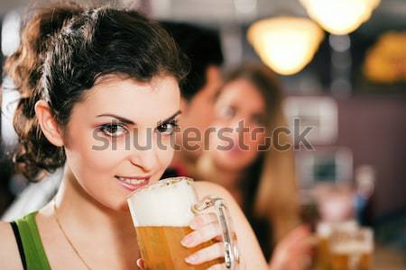 People in bar, woman being abandoned and sad Stock photo © Kzenon