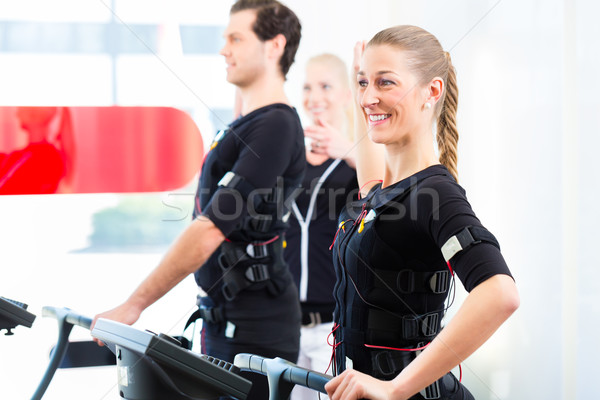 Férfi nő képzés női edző izmos Stock fotó © Kzenon