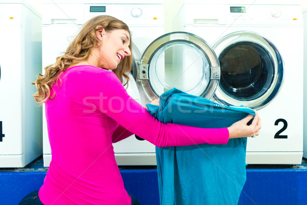 Female student in a laundry Stock photo © Kzenon