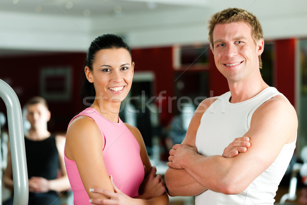 Sportive couple in gym Stock photo © Kzenon