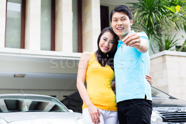 Chinese couple showing keys to their new home Stock photo © Kzenon