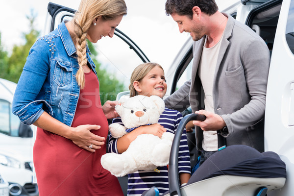 Family buying car, mother, father and child at dealership Stock photo © Kzenon