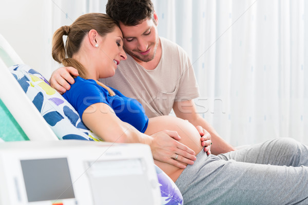 Pregnant woman in delivery room with her man Stock photo © Kzenon