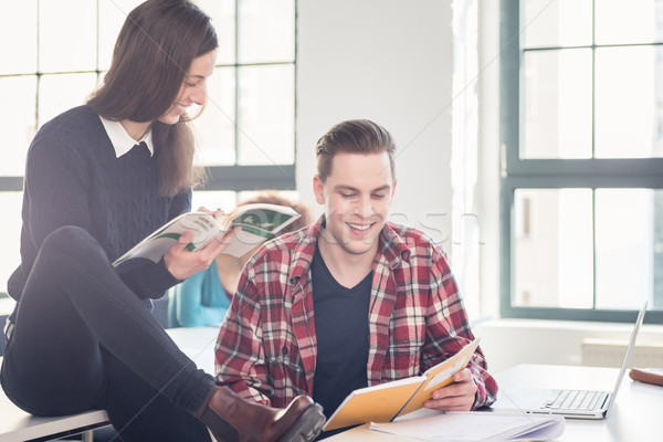 Two cheerful students checking information and knowledge Stock photo © Kzenon