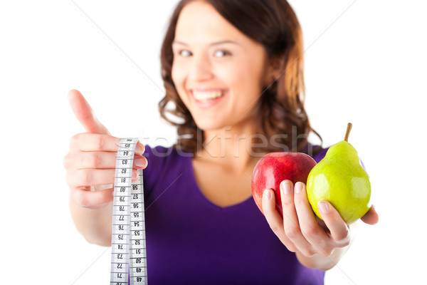 Woman with apple, pear and measuring tape Stock photo © Kzenon