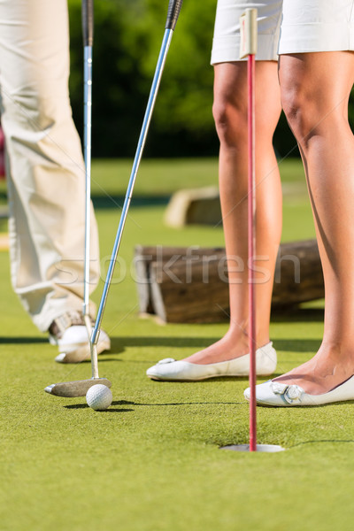 People playing miniature golf outdoors Stock photo © Kzenon