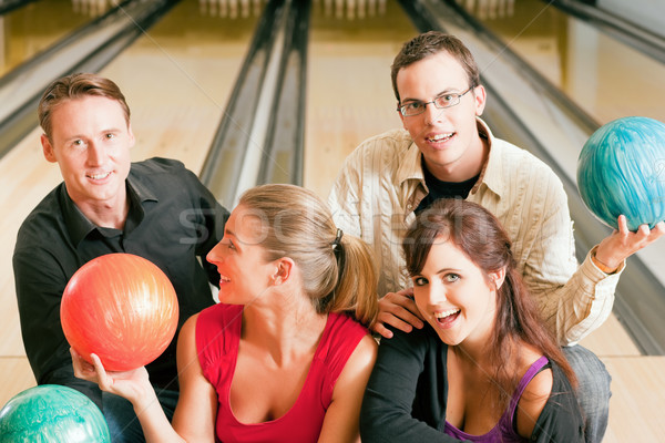 Friends bowling together Stock photo © Kzenon