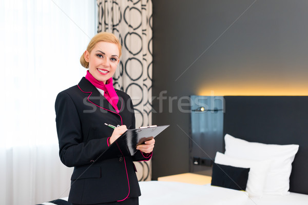 Housekeeper checking hotel room Stock photo © Kzenon