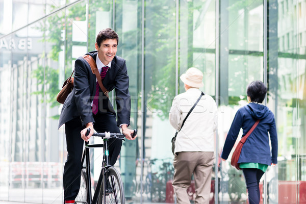 Alegre jóvenes empleado equitación utilidad bicicleta Foto stock © Kzenon