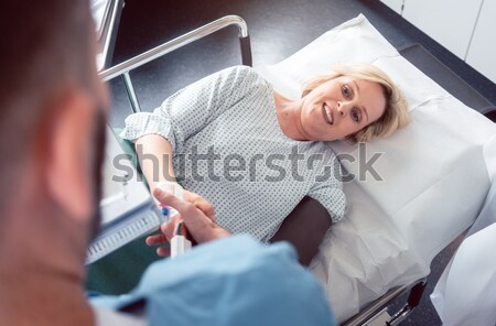 Doctor greeting patient before starting treatment Stock photo © Kzenon