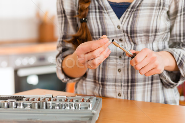 Woman with toolbox and screwdriver Stock photo © Kzenon