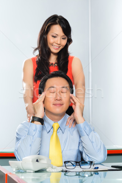Asian Colleagues having office affair Stock photo © Kzenon