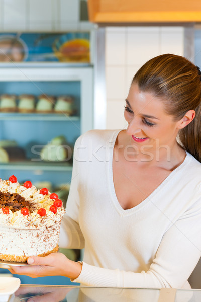 Stock photo: Female baker or pastry chef with torte