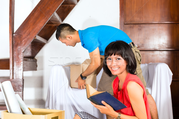 Asian couple moving in the new home Stock photo © Kzenon