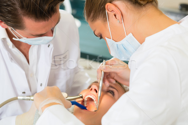 Paciente dentista dental tratamento feminino assistente Foto stock © Kzenon