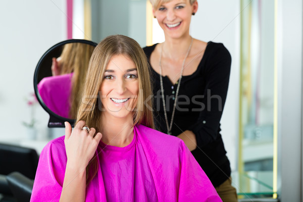 Woman at the hairdresser getting advise Stock photo © Kzenon