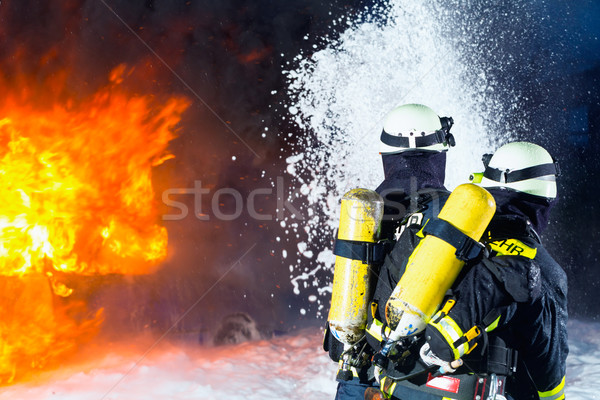 Firefighter - Firemen extinguishing a large blaze Stock photo © Kzenon