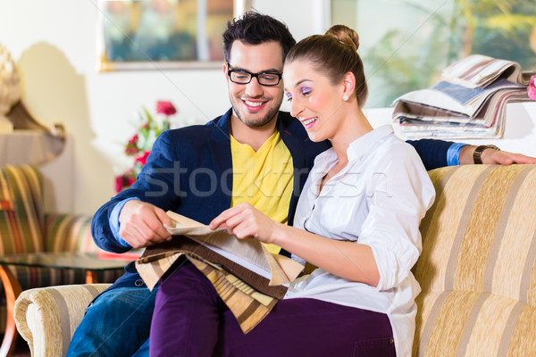 Couple picking couch seat cover in furniture store Stock photo © Kzenon