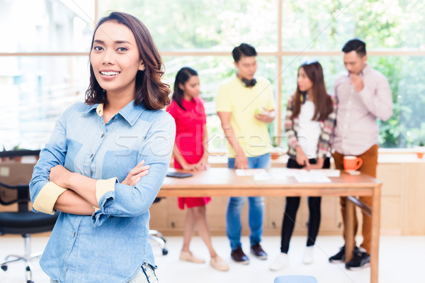 Young Asian woman looking at camera with self-confidence and det Stock photo © Kzenon