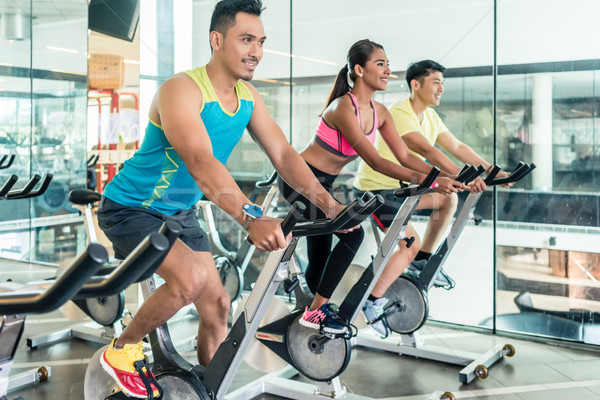 handsome and confident young man during group class of HIIT indo Stock photo © Kzenon