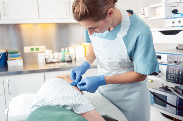 Nurse preparing patient for gastroscopy Stock photo © Kzenon