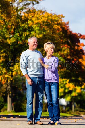 Jesienią spadek spaceru strony starszy para Zdjęcia stock © Kzenon
