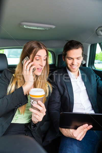 People traveling in taxi, they have an appointment Stock photo © Kzenon