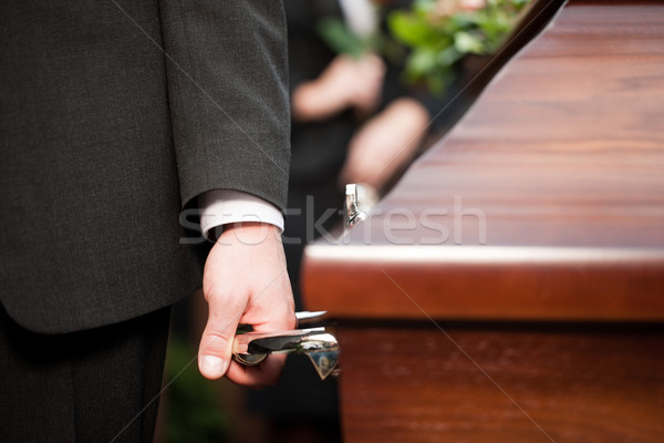 coffin bearer carrying casket at funeral Stock photo © Kzenon